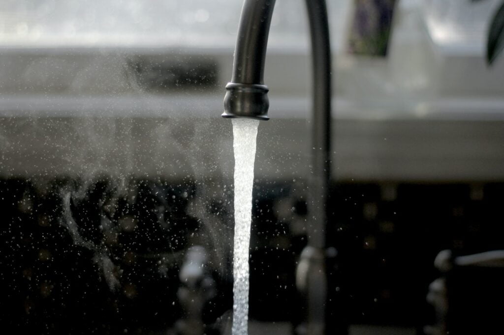conserving water running faucet